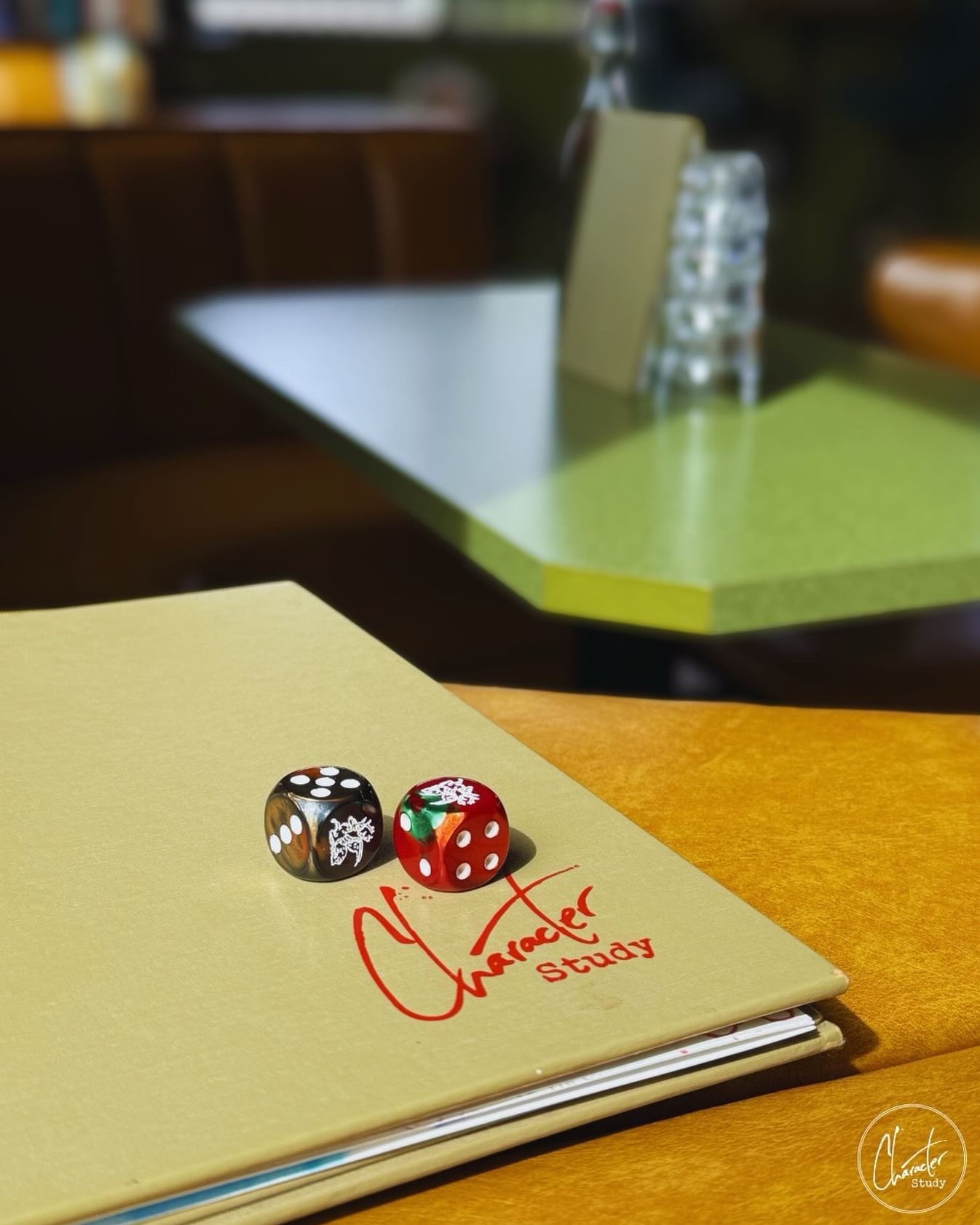 Custom branding detail at Character Study featuring themed dice and menu.