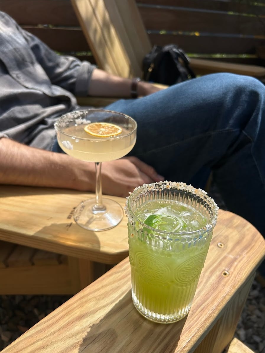 Craft cocktails enjoyed on the outdoor patio seating with Adirondack chairs