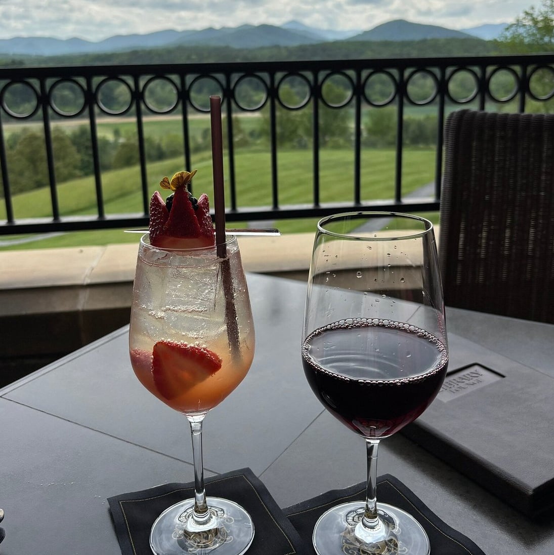Cocktails and wine enjoyed on the terrace with sweeping mountain views