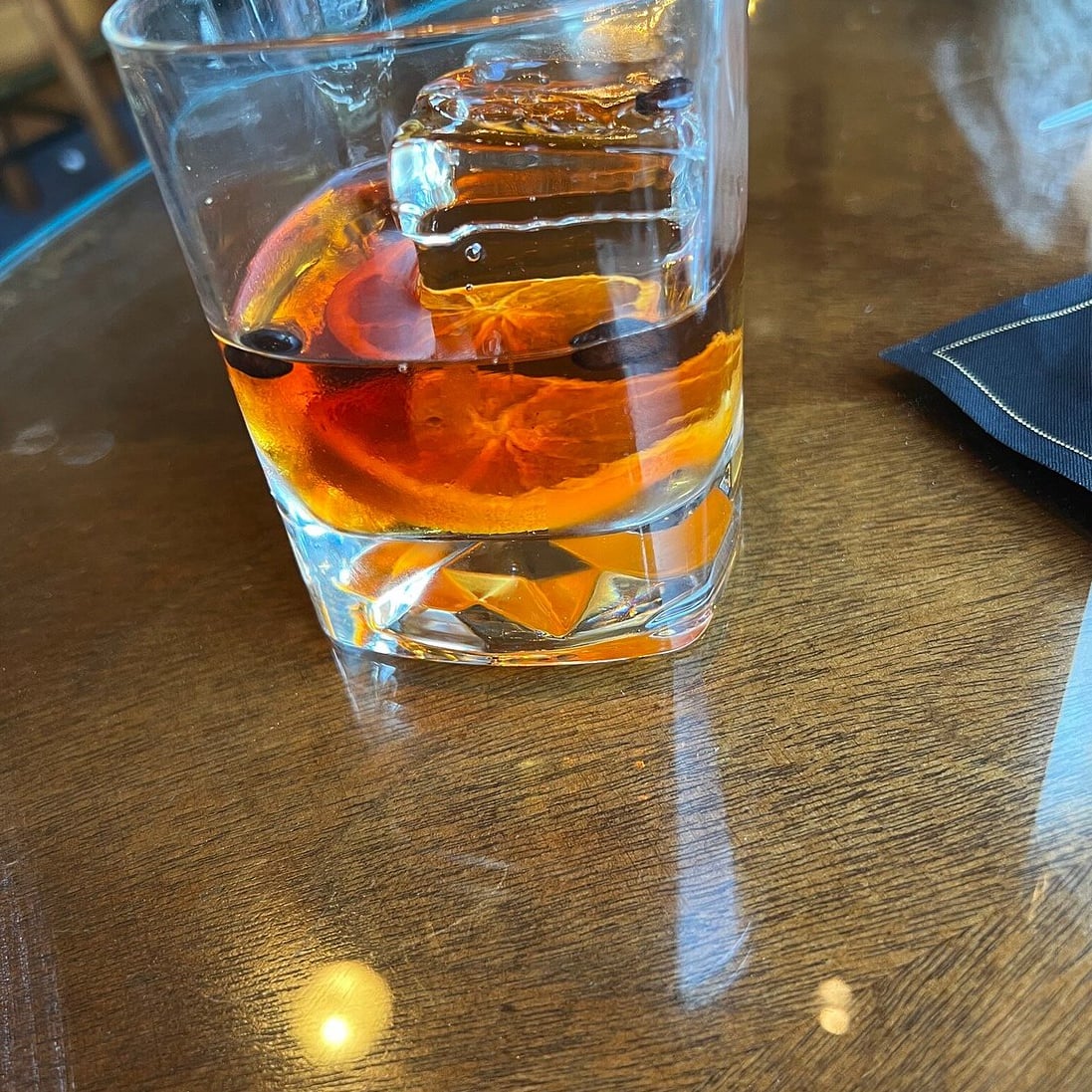 Smoked Old Fashioned with an orange twist, served on the rocks