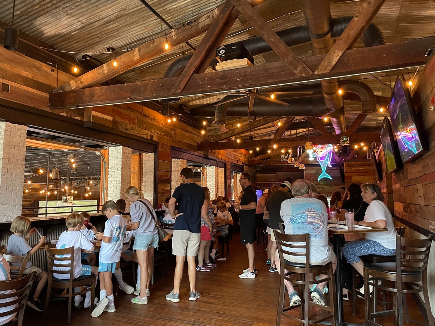 Rustic interior dining hall with warm ambient lighting and industrial-chic decor