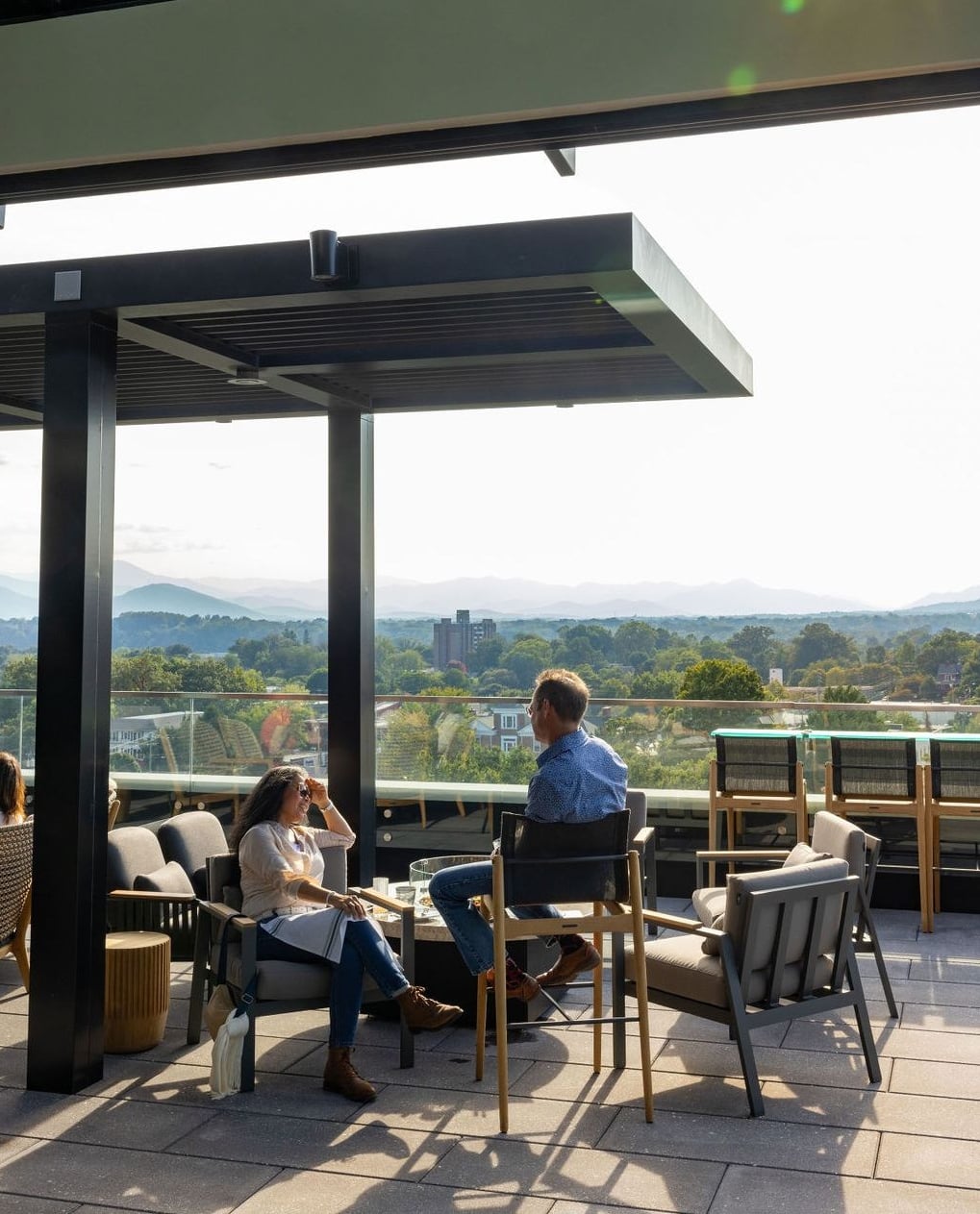 Relaxing rooftop patio overlooking the mountains.