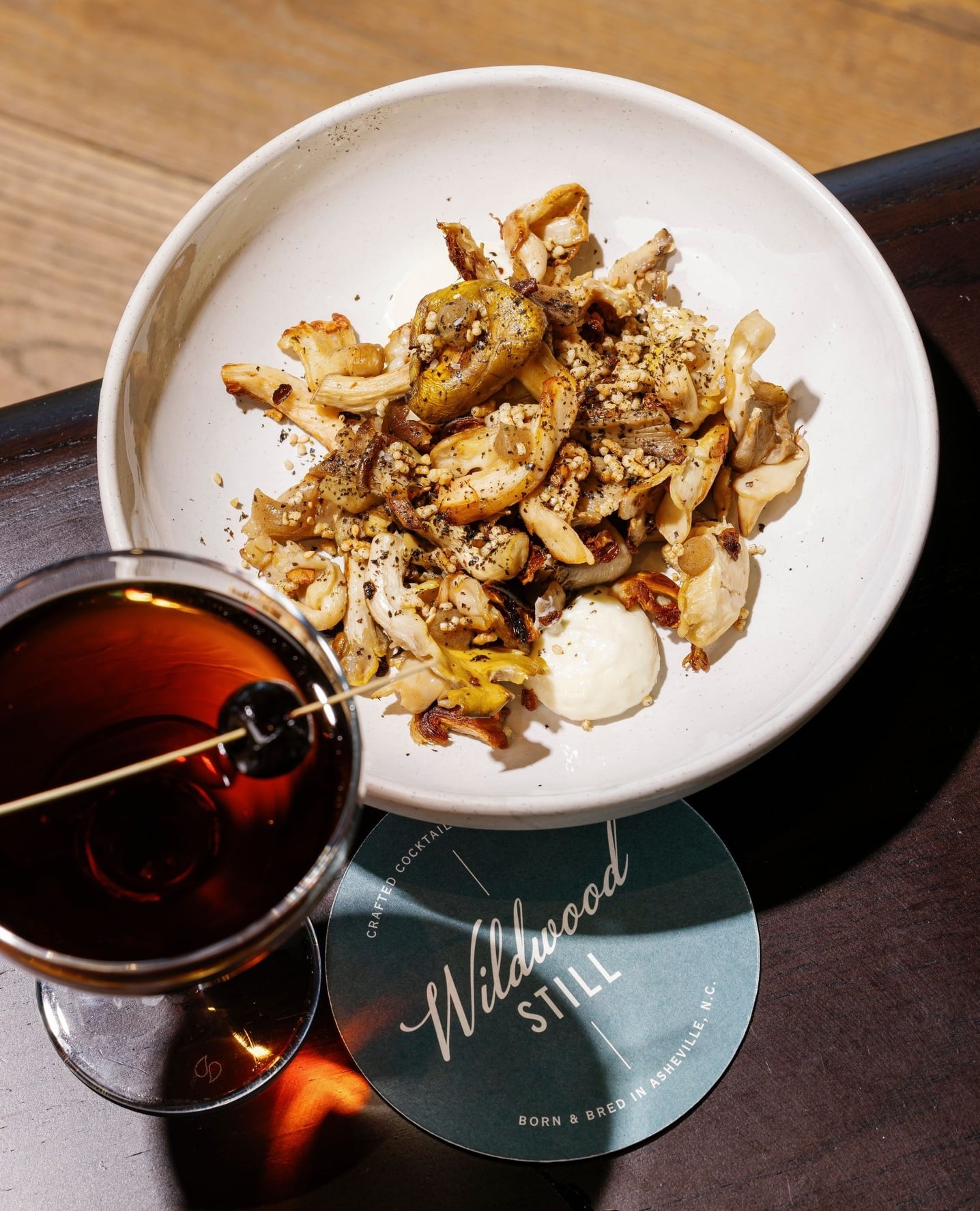 Roasted vegetable dish served with craft cocktails from Wildwood.