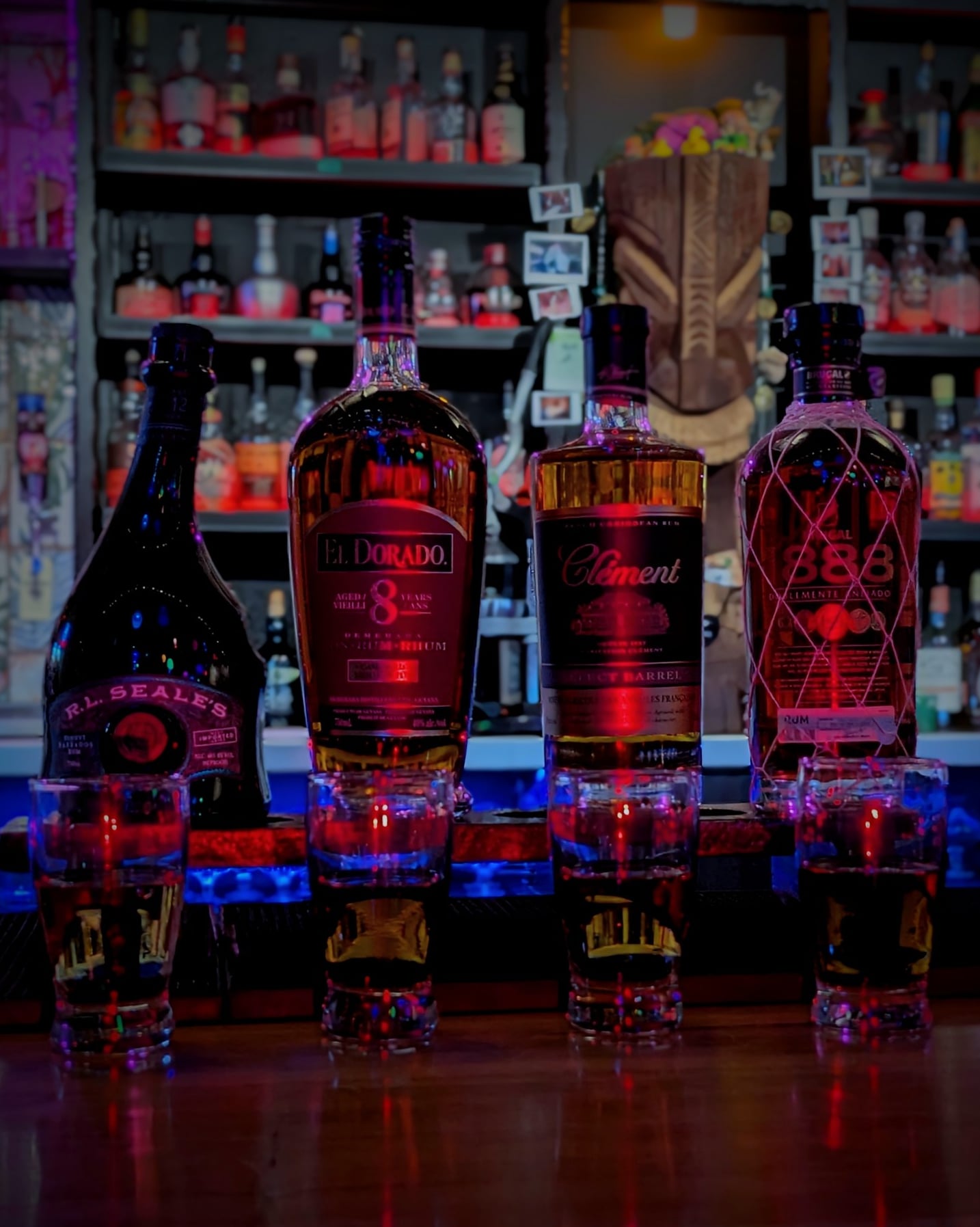 Rum selection on the backlit bar counter.