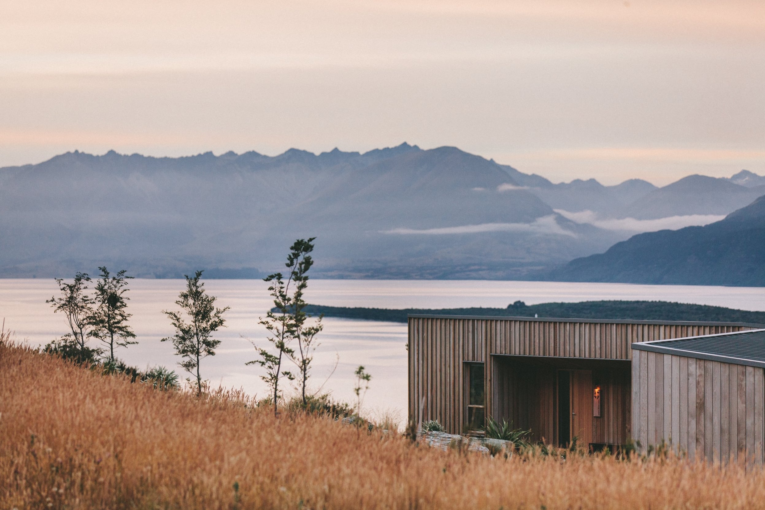 Scenic exterior of the modern lodge venue with mountain views.