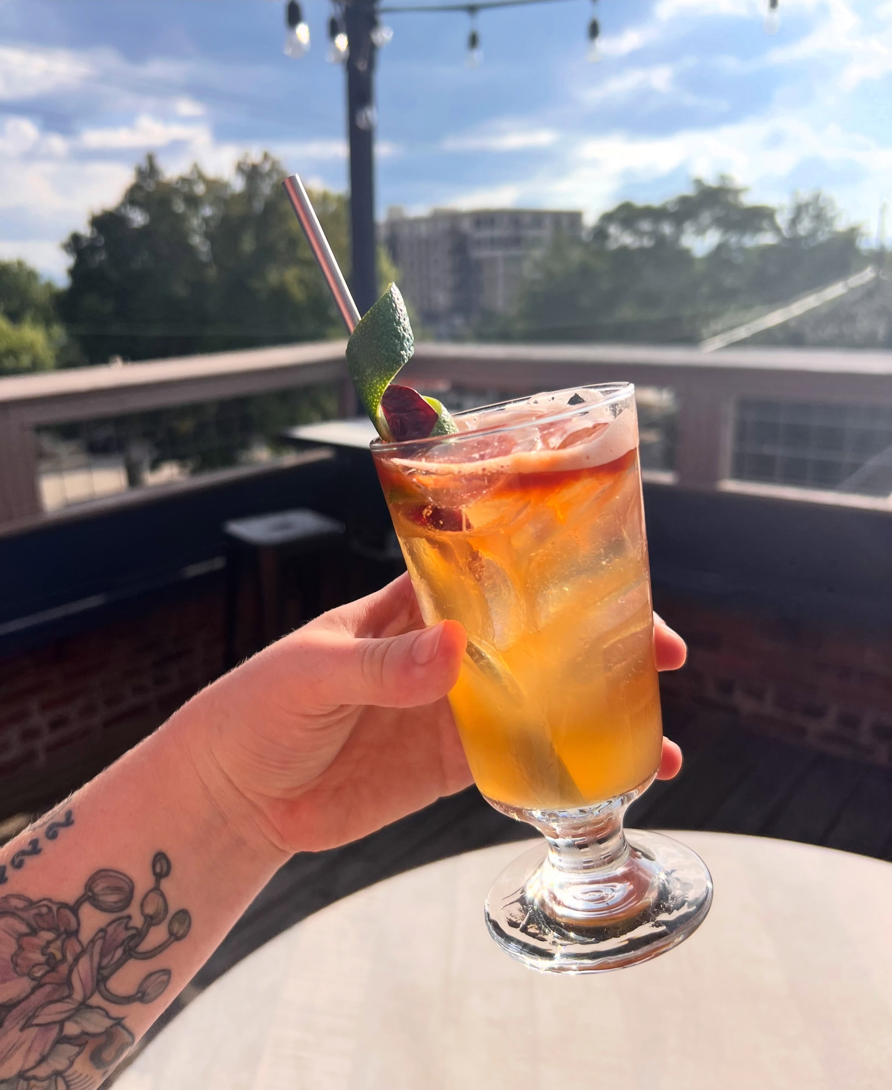 A highball on the rooftop patio