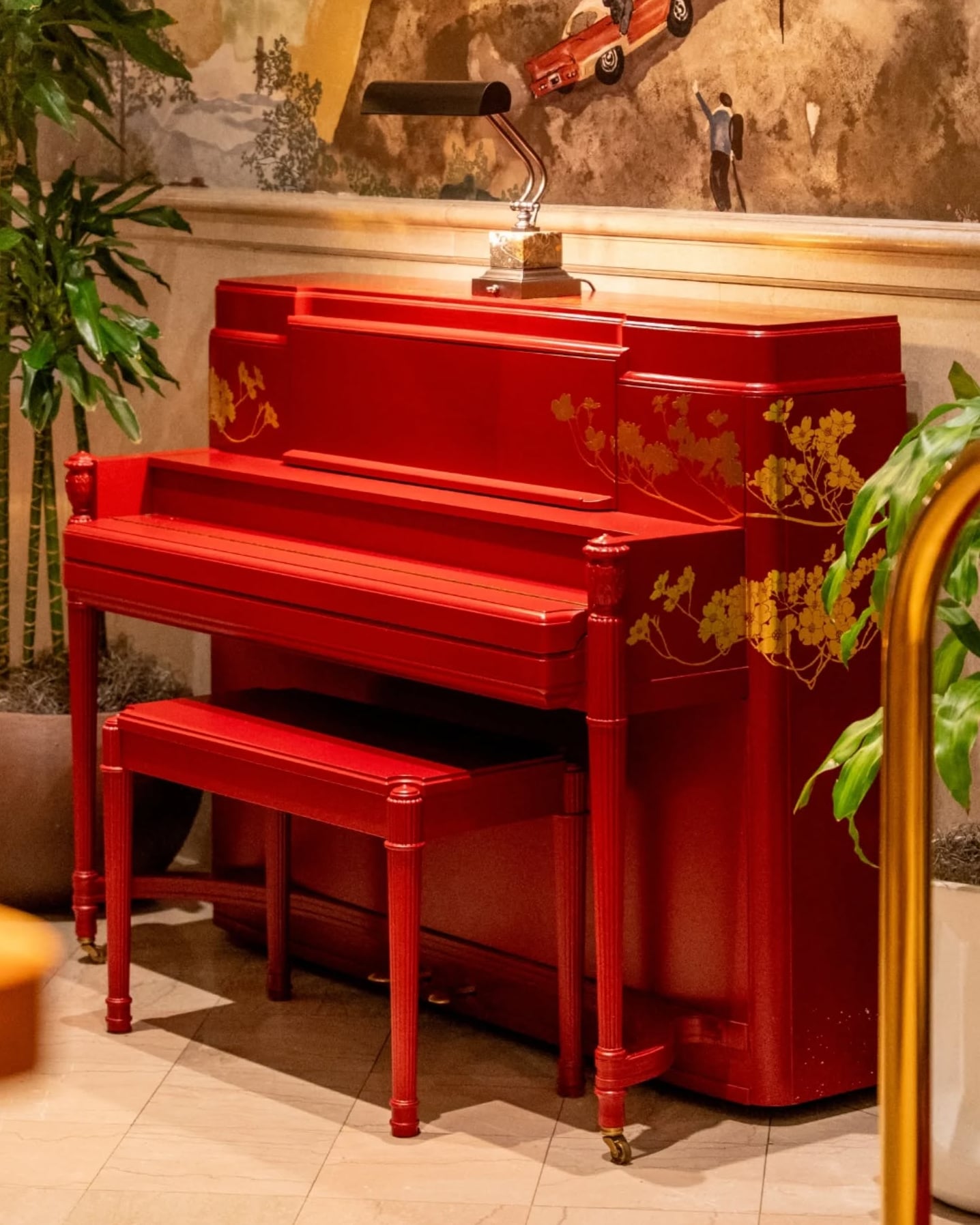 Vibrant red piano adds character to the lounge interior