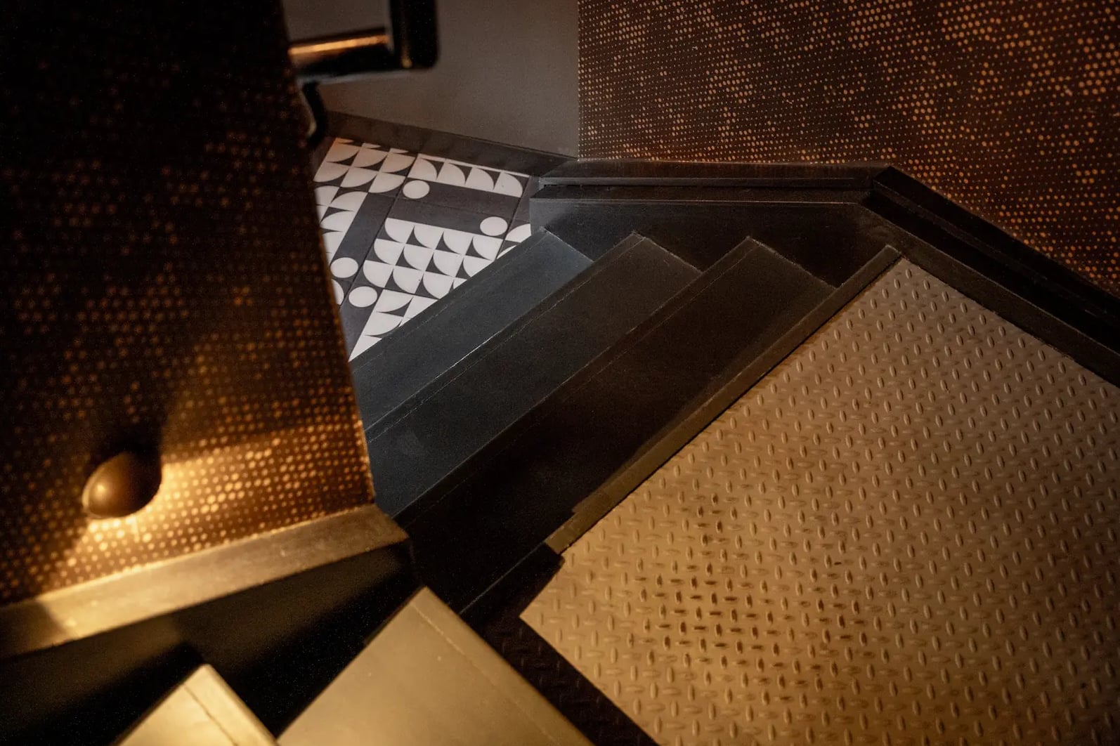 The descent: vintage-tiled staircase leading down to the speakeasy