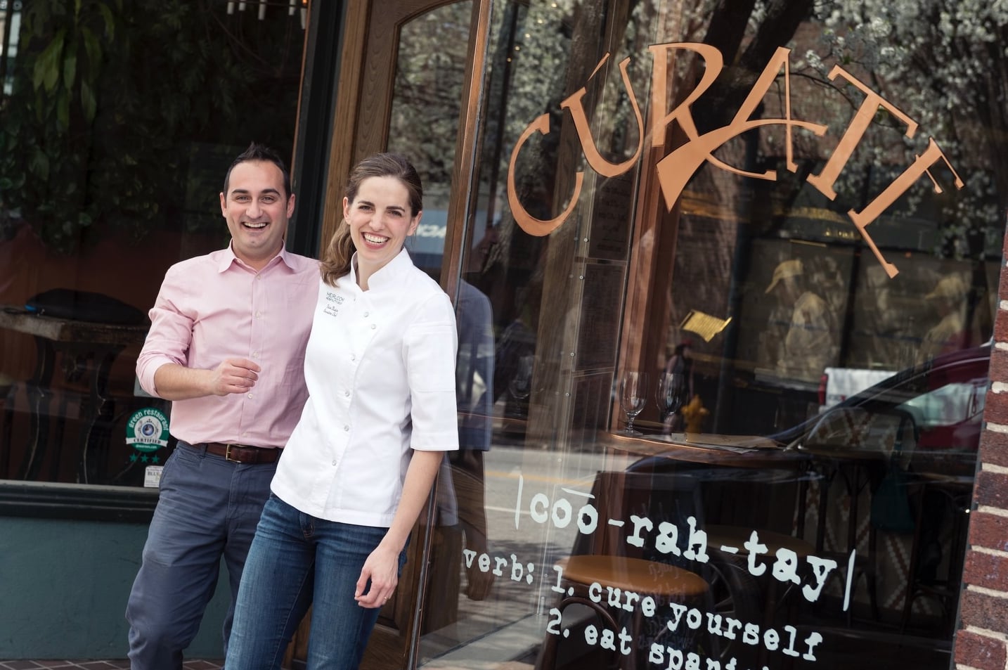 Front entrance of Cúrate featuring the Spanish menu definition on the glass.
