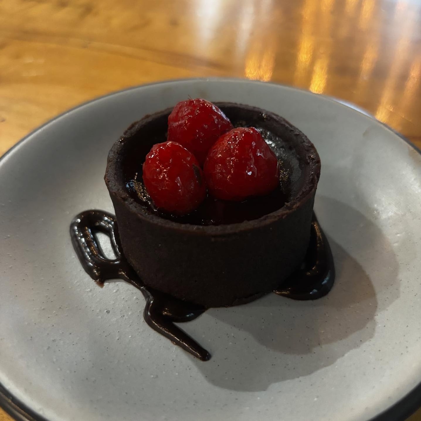 Decadent chocolate dessert with fresh raspberries