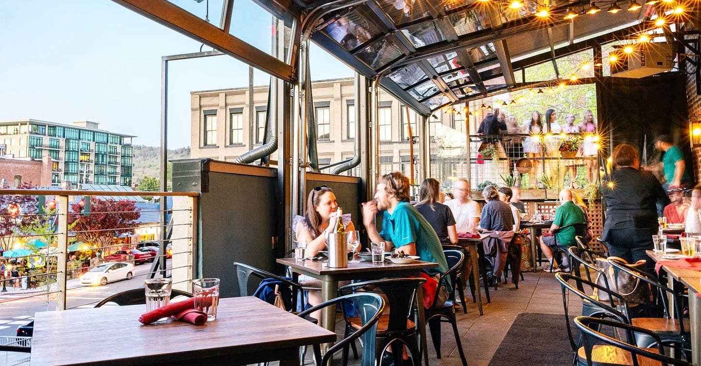 Bright, industrial-style patio seating area under the sun.