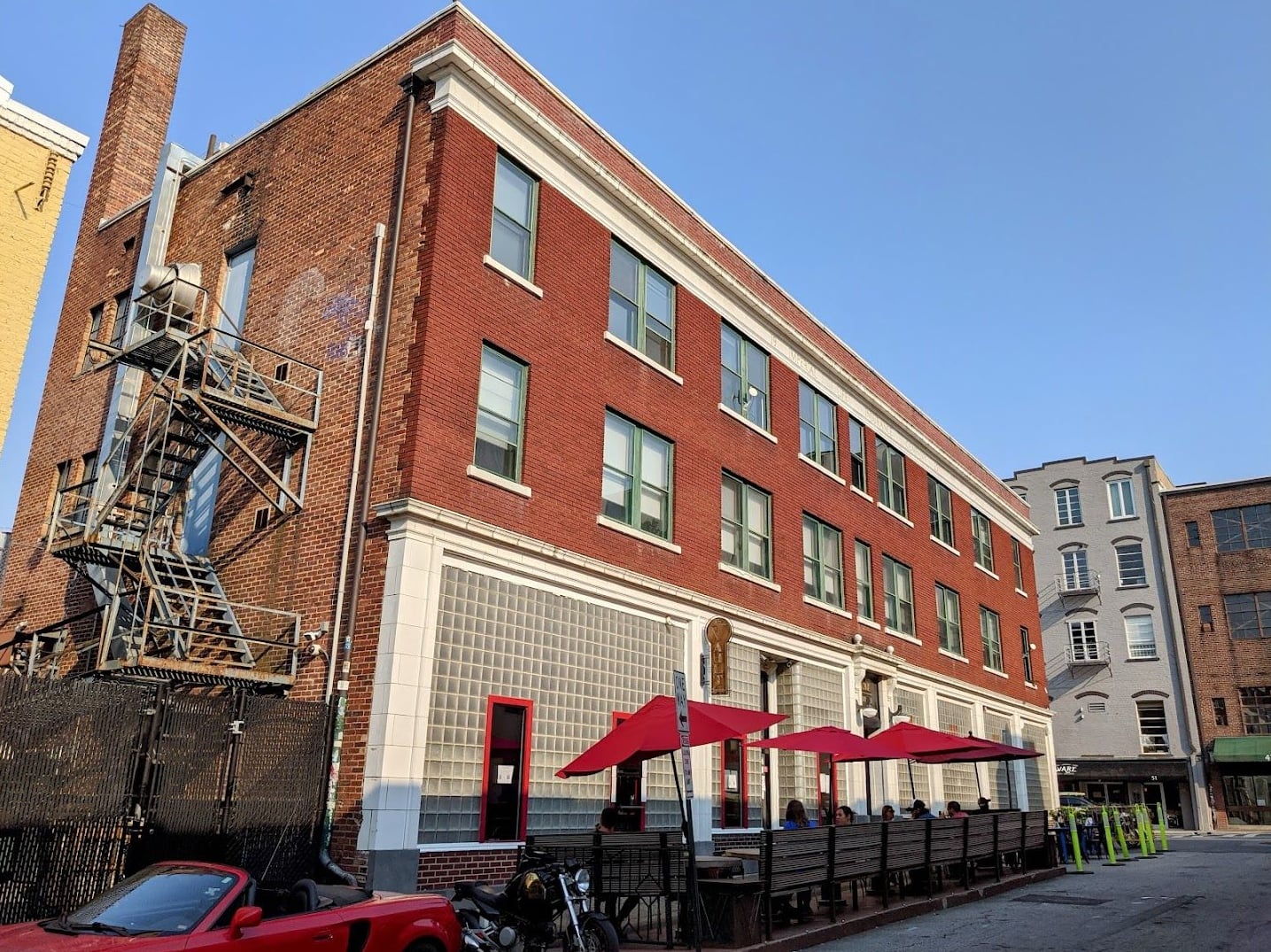 The Rankin Vault building exterior with outdoor patio seating on Rankin Ave.
