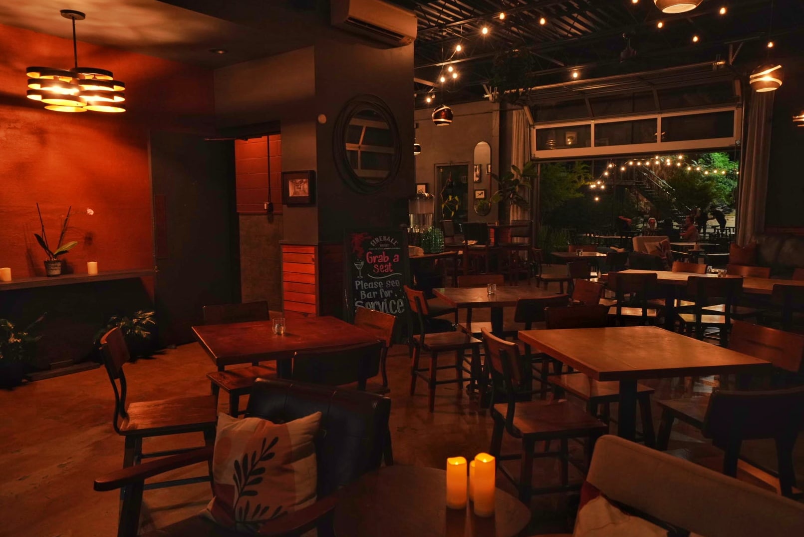 Intimate interior with warm lighting and exposed brick walls.