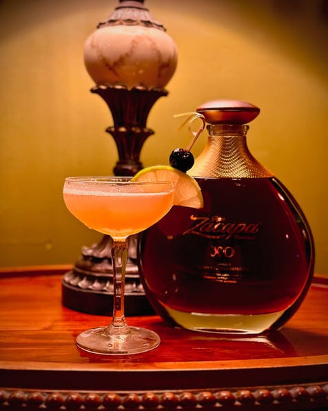 Classic cocktail featuring Zacapa Rum garnished with citrus and cherry
