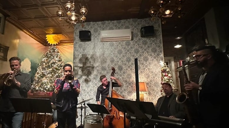Live jazz night beneath the tin ceiling amid holiday decor