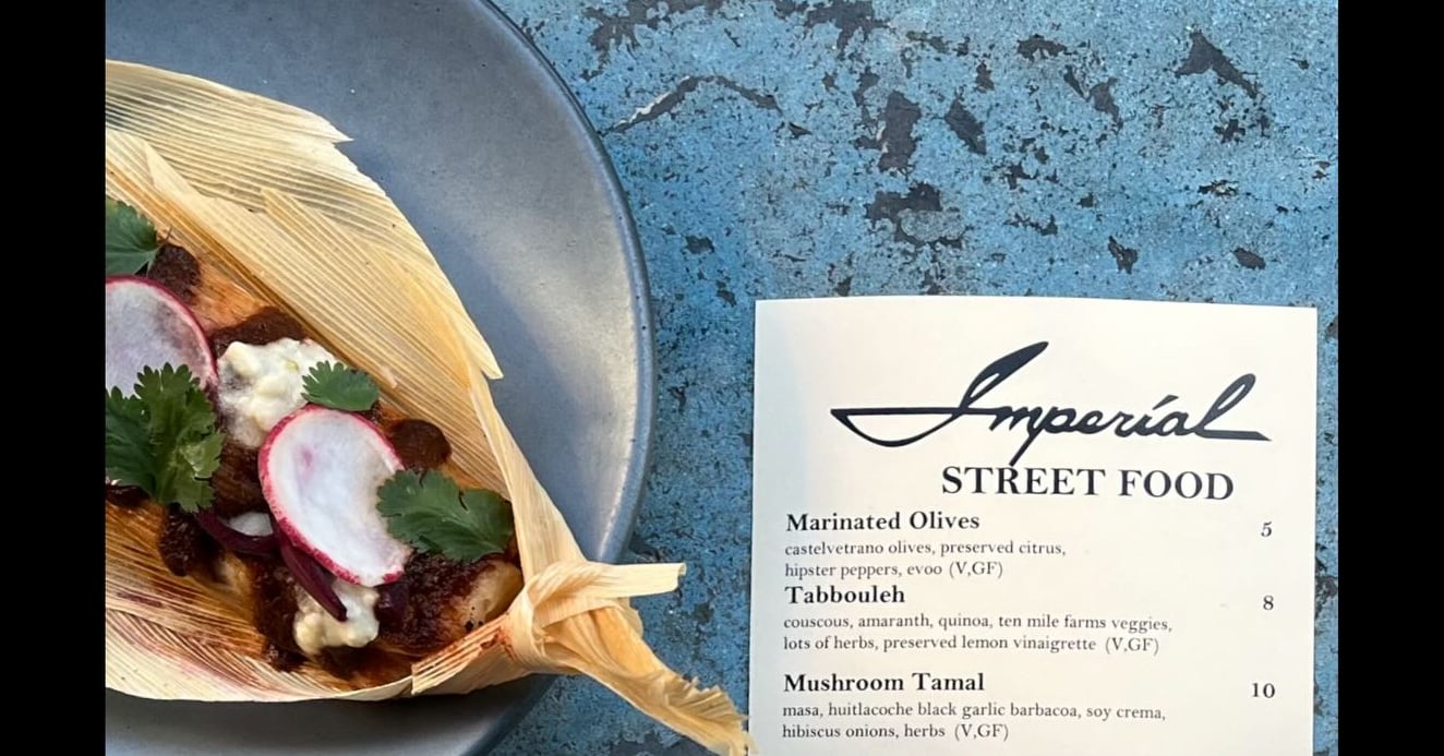 Mushroom Tamal from the seasonal menu at Imperial Street Food with ingredients including black garlic barbacoa and soy crema.