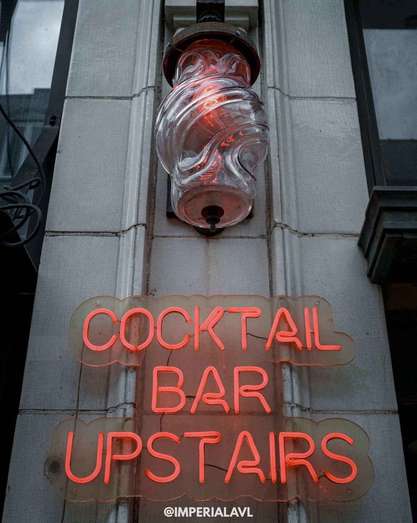 Classic neon signage for the cocktail bar tucked away up the stairs.