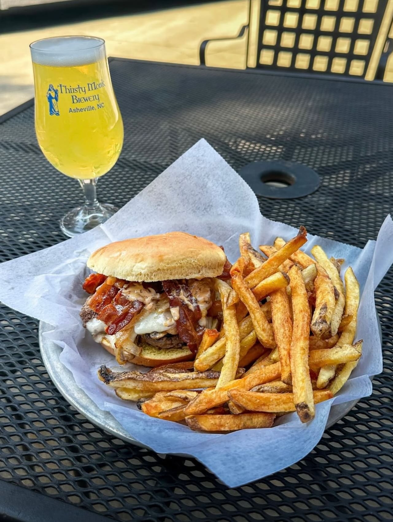Smash burger with fries and cold beer