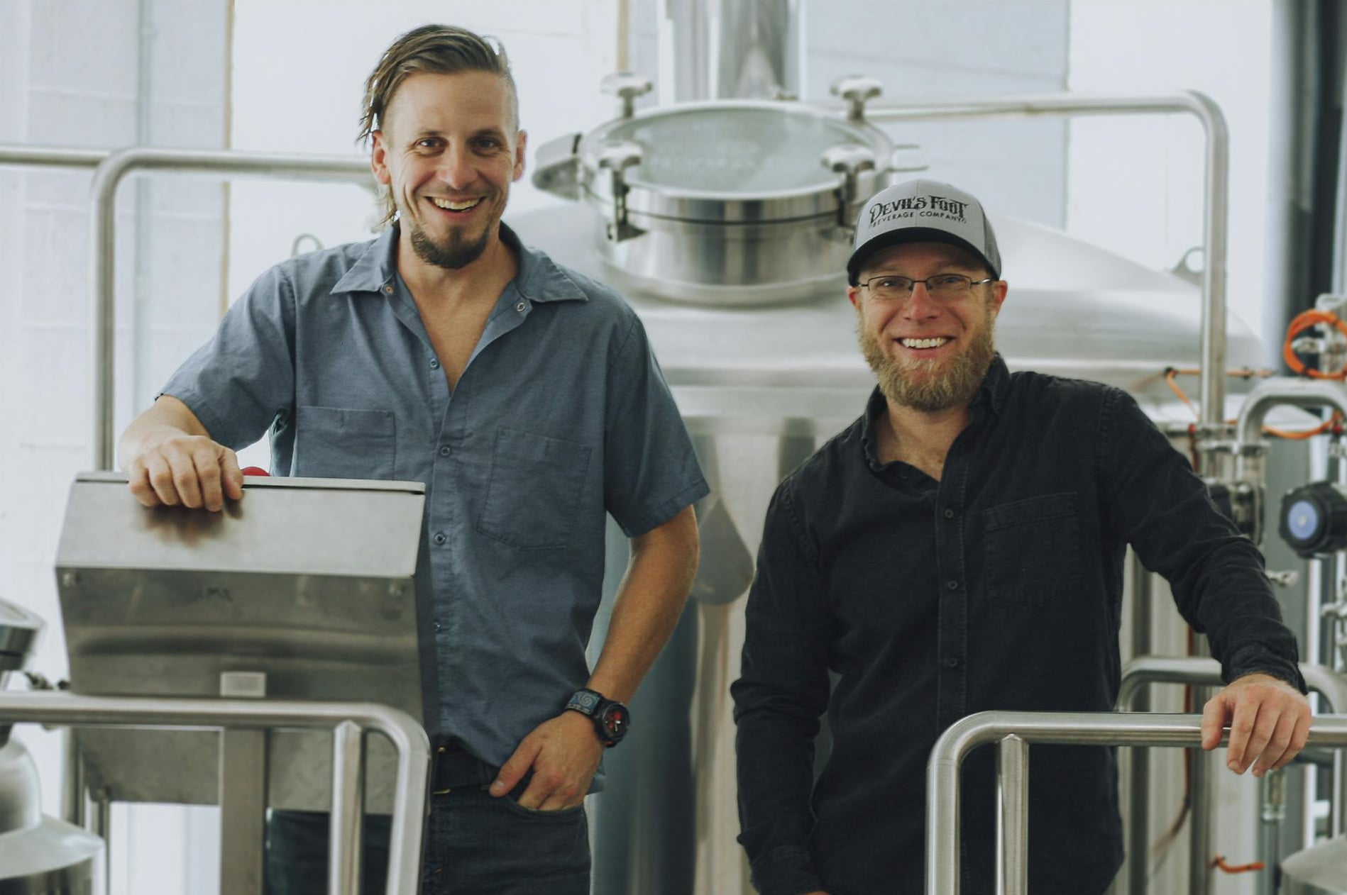 Devil's Foot founders at their Sweeten Creek Road brewhouse production tanks