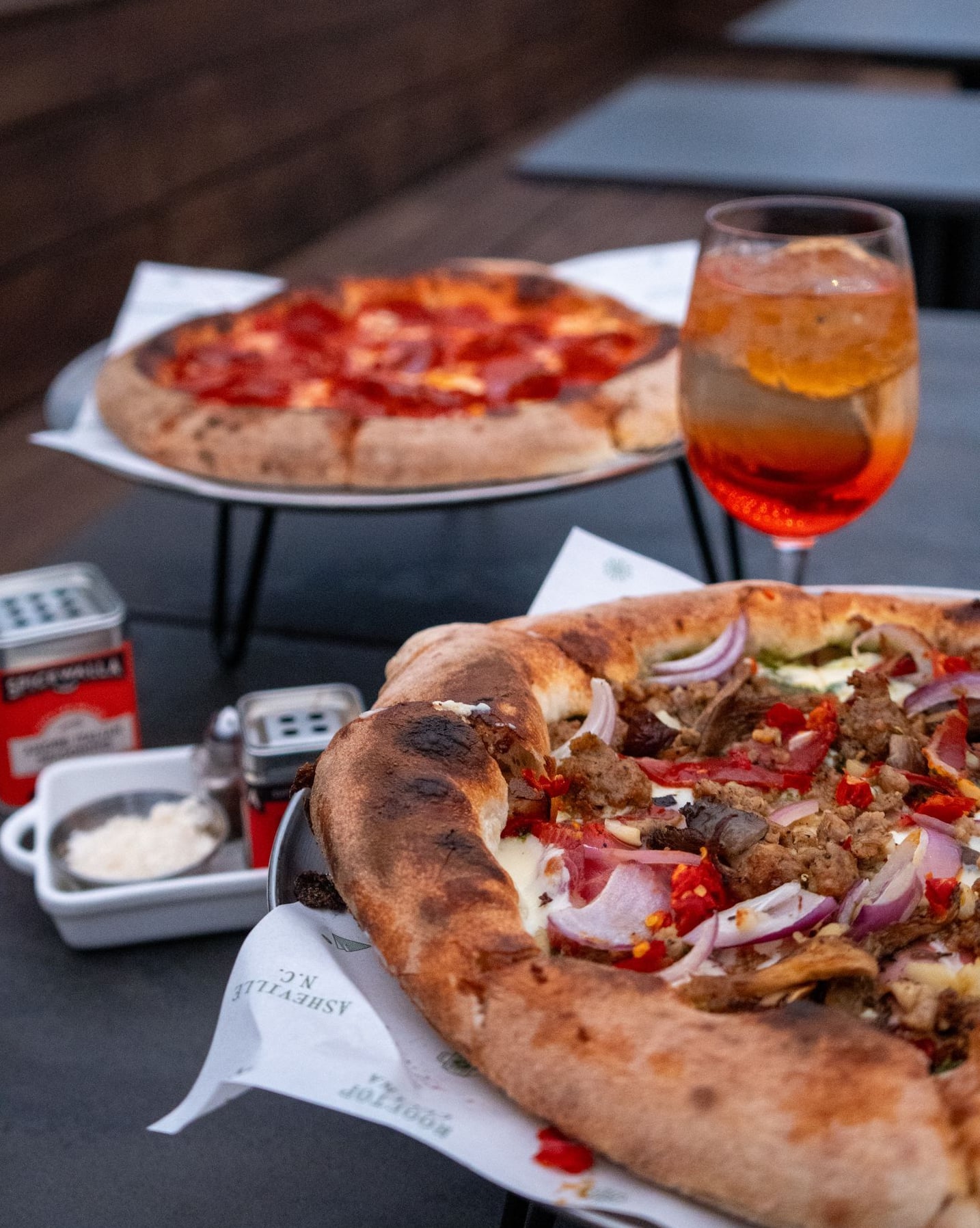 Wood-fired pizzas and drinks at Soprana Rooftop.