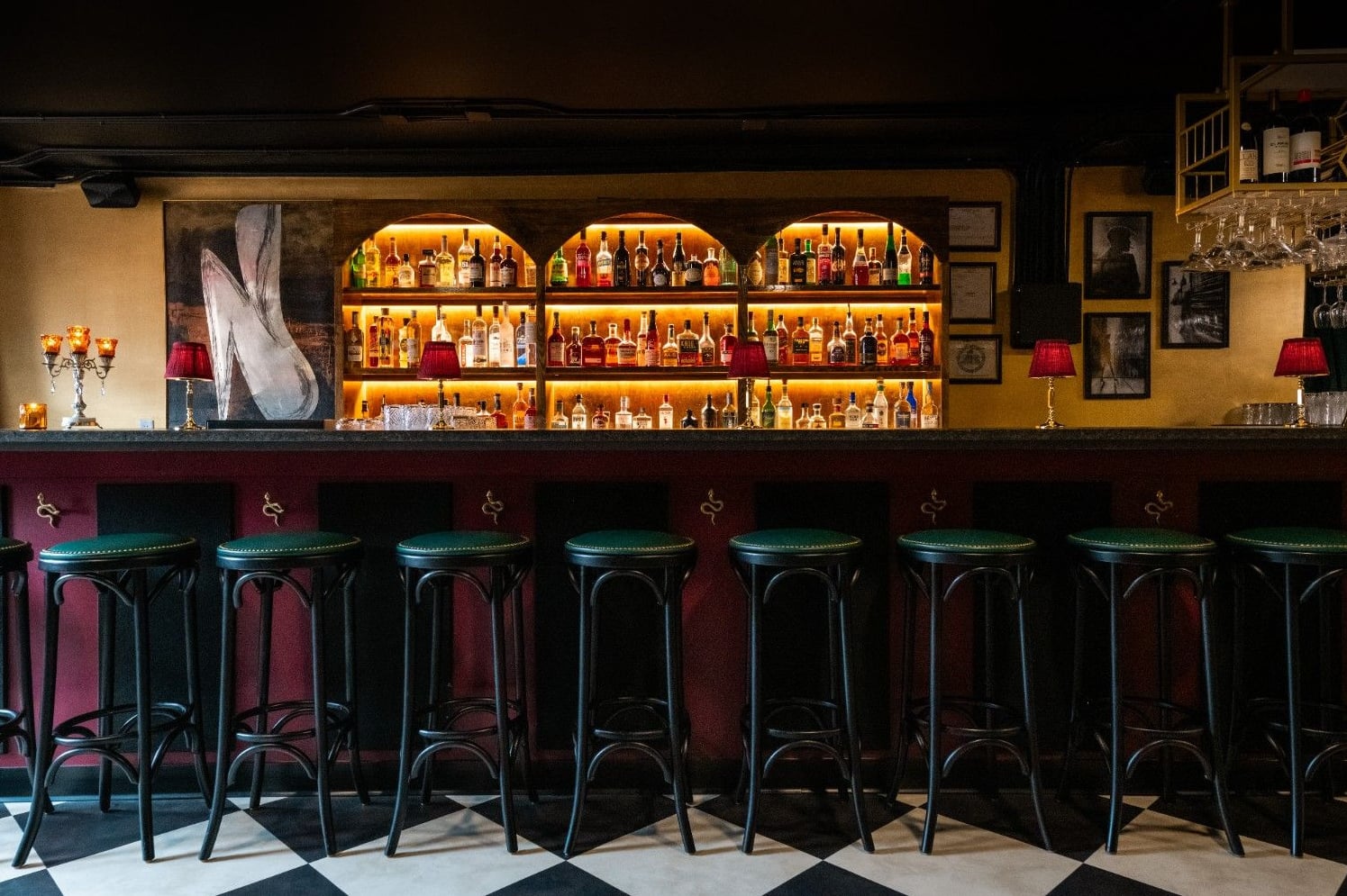 Sophisticated bar with glowing backbar and vintage ambiance