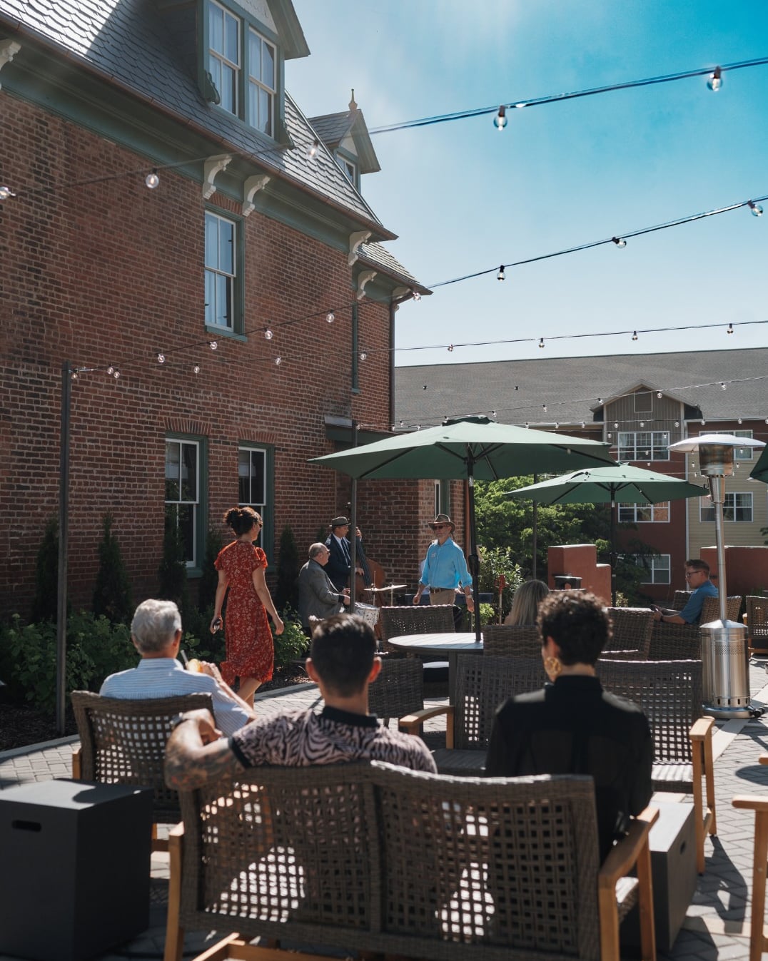 Sunny outdoor patio with live jazz and vintage-inspired ambiance.