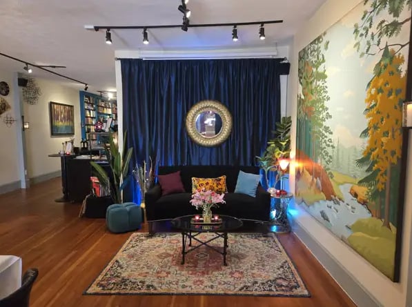 The Argot Room — Jargon's eclectic lounge with mural, plush seating, and vintage decor