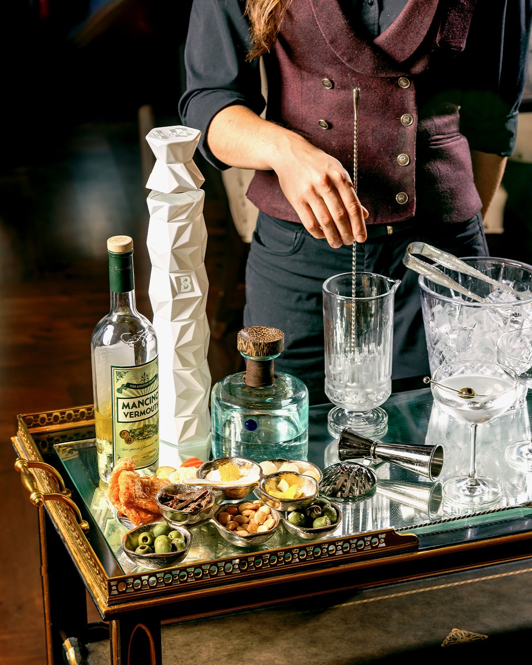 Bartender crafting cocktail with care