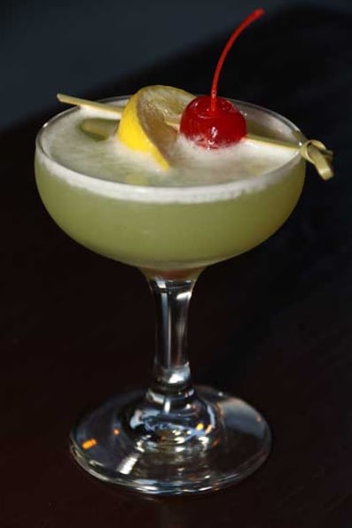 Signature green drink with silky foam and cherry on top